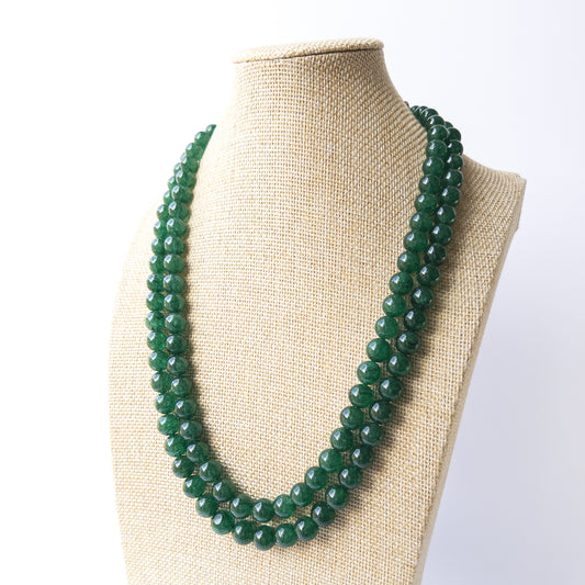 Genuine Emerald gemstone beads with polished smooth round shapes, ideal for DIY jewellery and artisan beadwork.