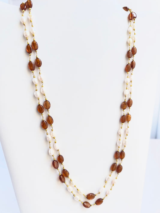 Hessonite with pearl stone beads necklace, warm golden hues and luminous glow, adjustable length.