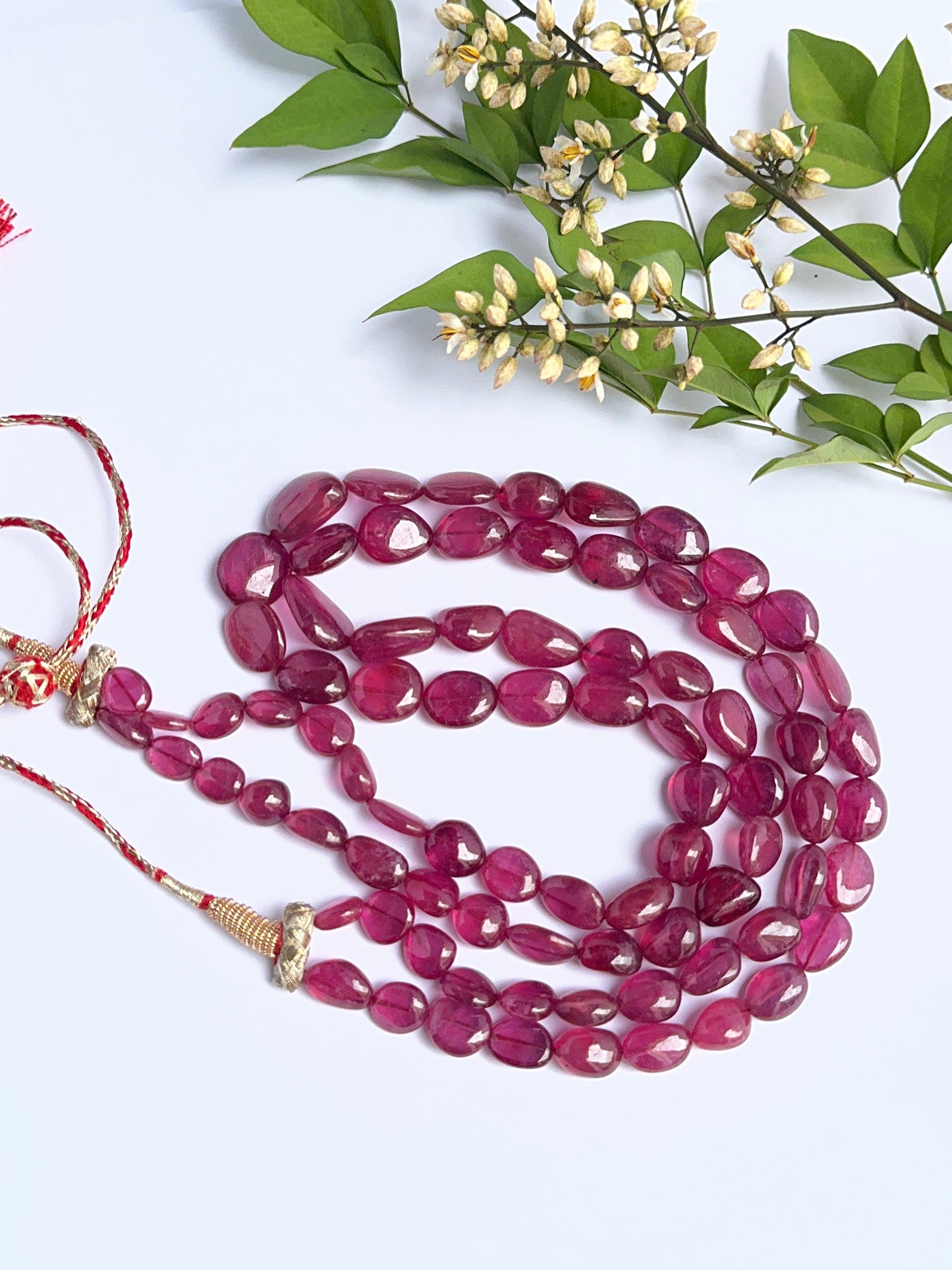 Elegant ruby necklace featuring large tumble beads in a bold layered design.