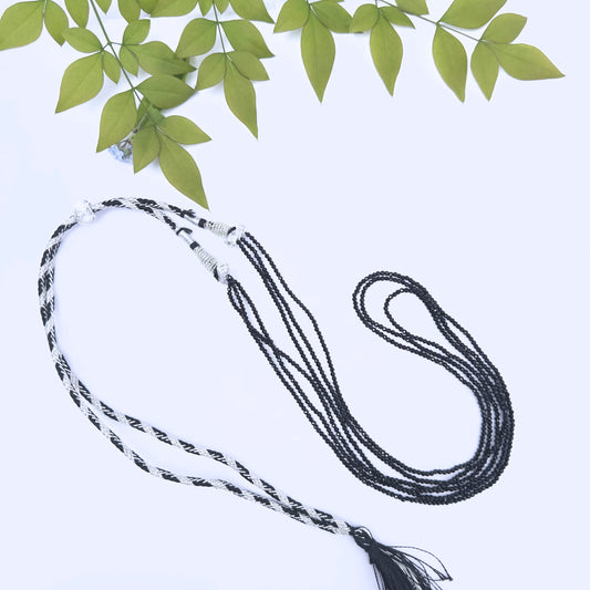 Close-up of faceted Black Spinel beads showing sparkle and polished finish.