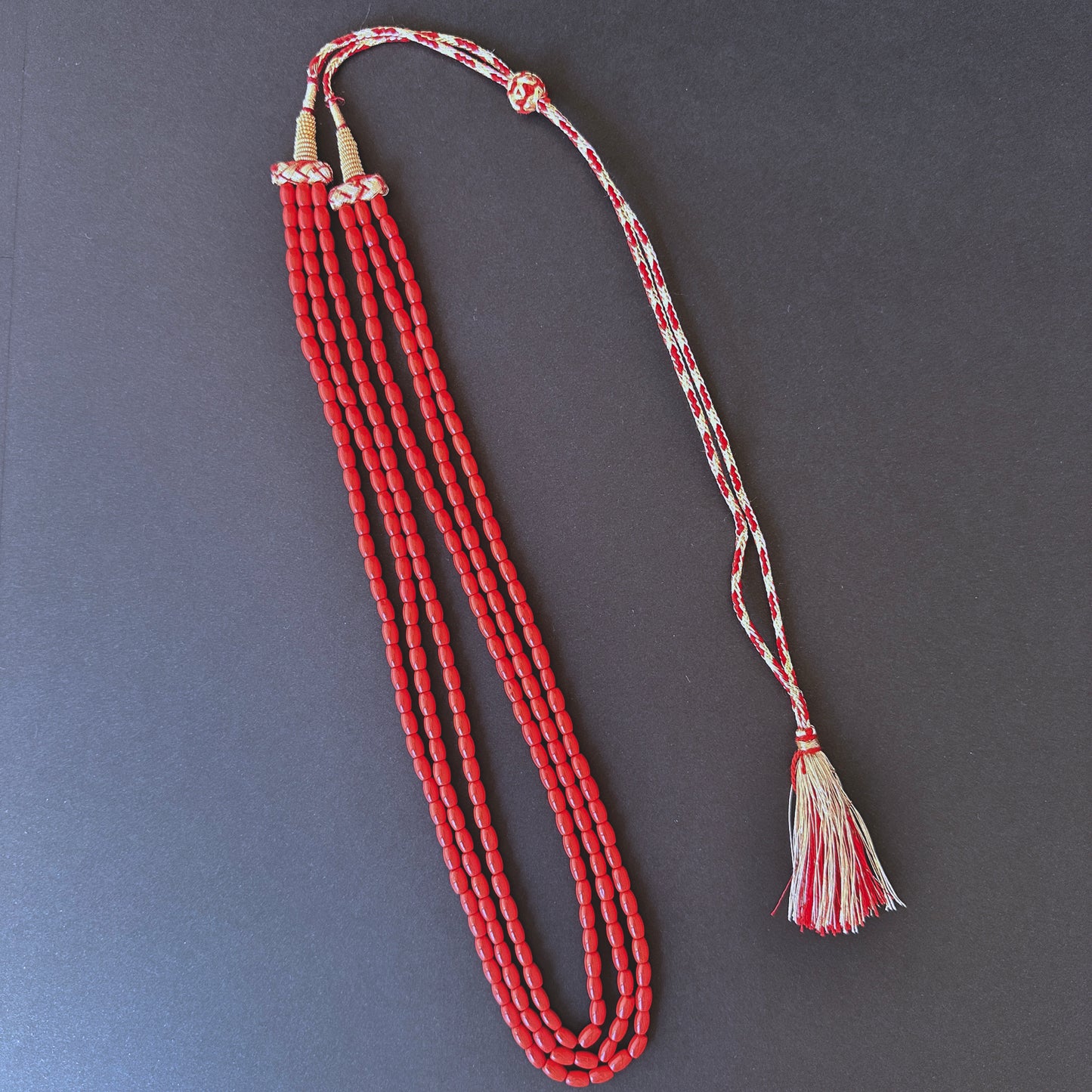 Coral stone beads necklace, smooth drum 4.2mm, arranged in a triple strand for refined style.