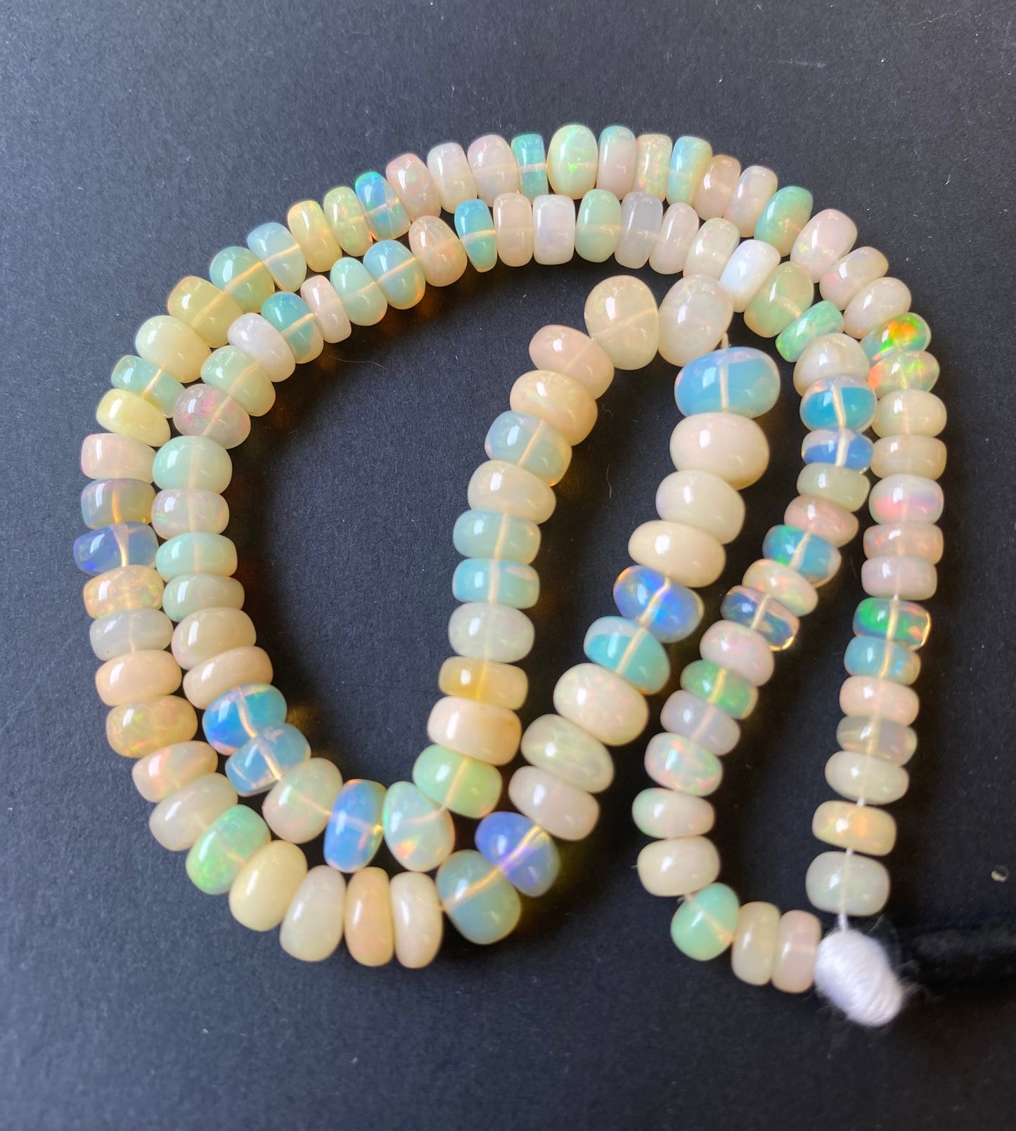 Ethiopian Opal | Smooth Wheel | 5.5-7.5mm Bead Size | 42cm Strand Length | 85 Carats