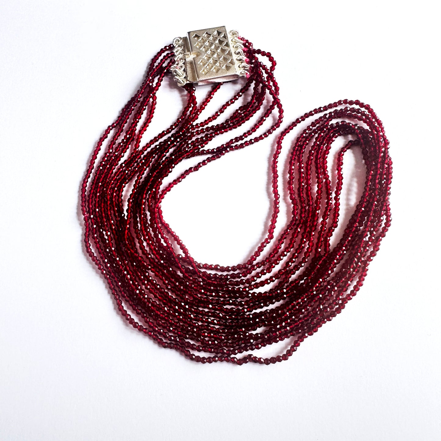 Close-up of faceted rondell chalcedony beads, 123 carats, highlighting clarity, polish, and natural gemstone brilliance.