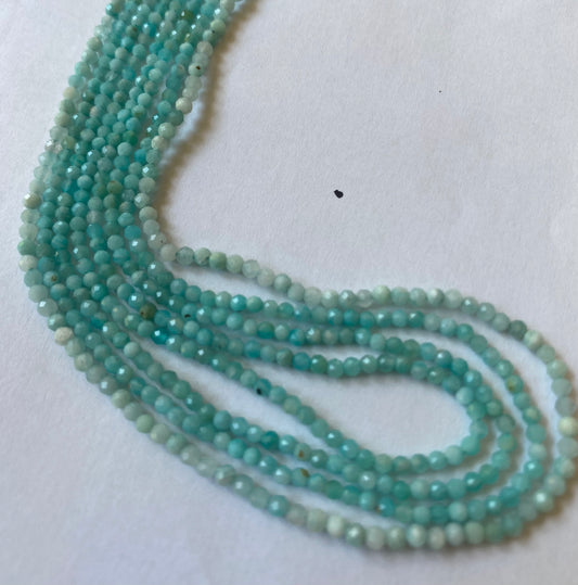 Elegant strands adorned with 2.2-2.5mm blue Amazonite faceted rondelle beads, showcasing a sleek design.