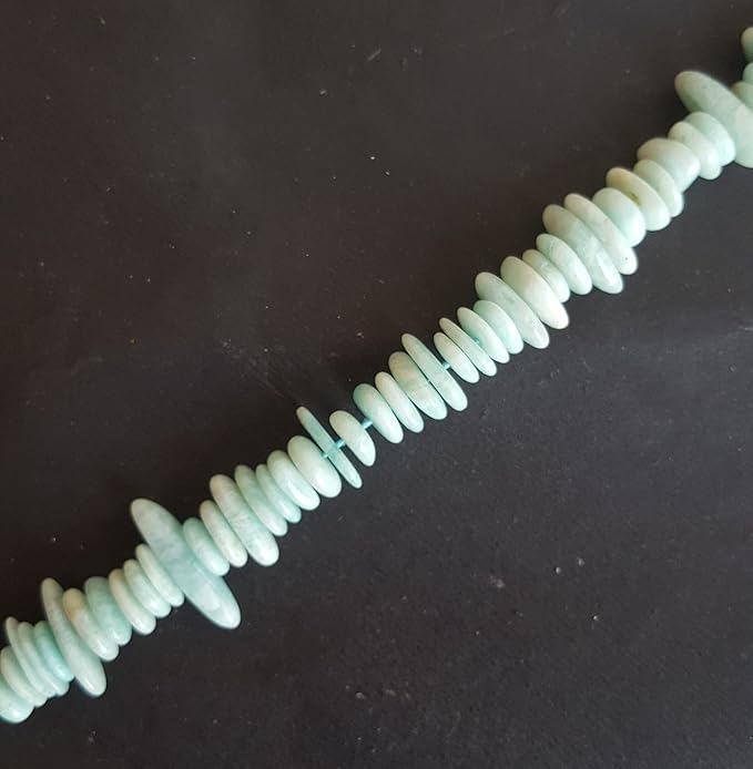 Strand featuring smooth disc beads in a vibrant green colour, showcasing the beauty of Amazonite.