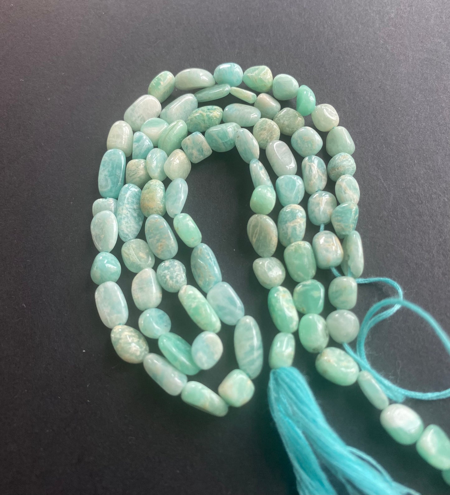 Stunning strand with 5mm to 6.5mm green Amazonite faceted rondelle beads, ideal for a stylish accessory.