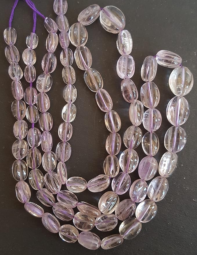 Strand featuring carved smooth amethyst gemstones, ranging from 8mm to 9mm, in a stunning purple hue.
