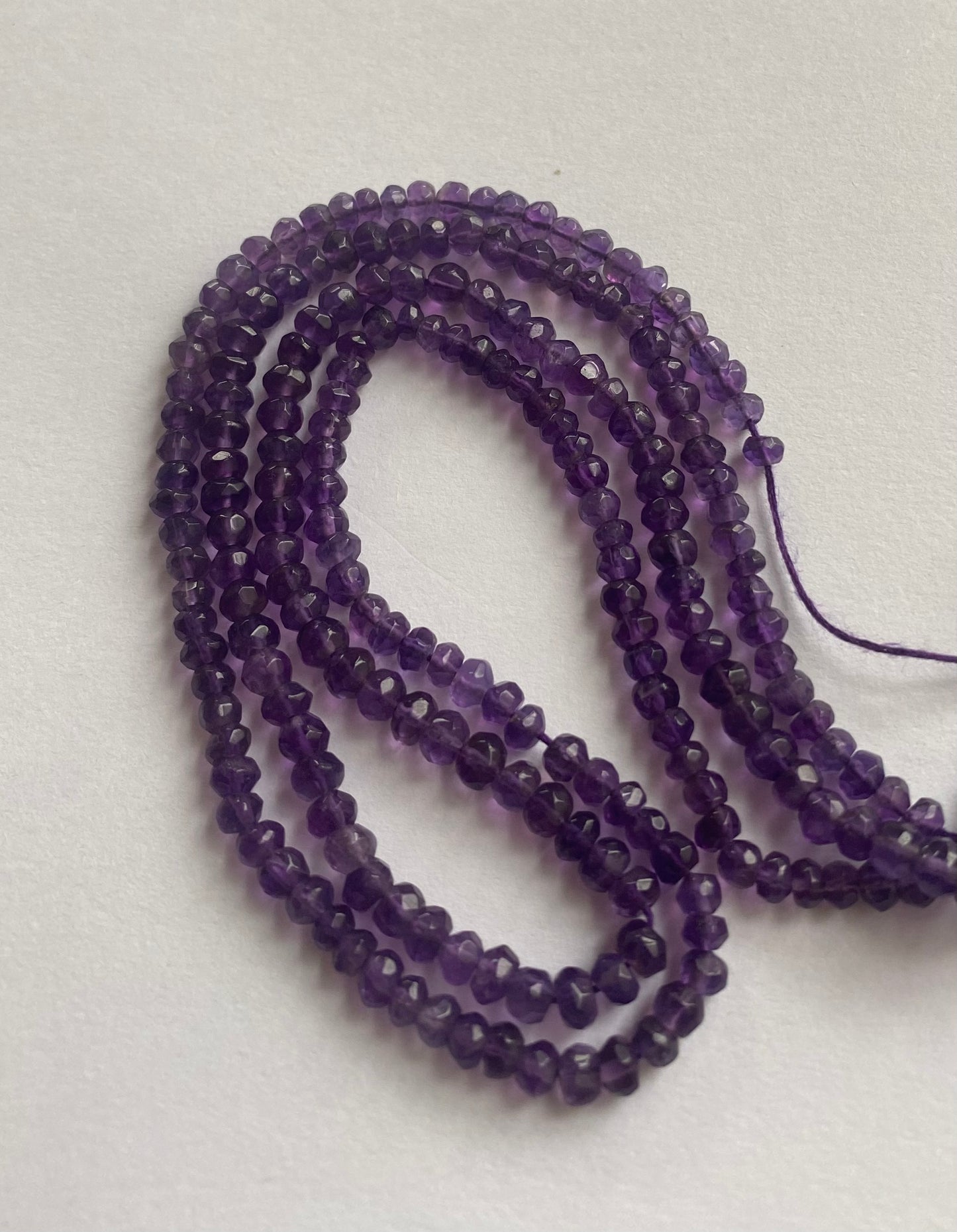 Elegant strand adorned with 3.5mm to 4mm faceted rondelle amethyst stones, showcasing a rich purple colour.