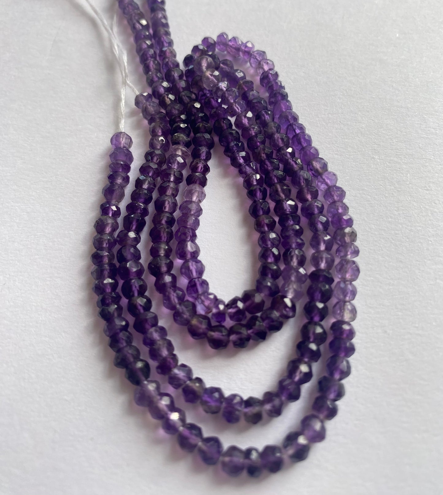 Strand featuring faceted rondelle amethyst gemstones, ranging from 4mm to 4.5mm in a stunning purple hue