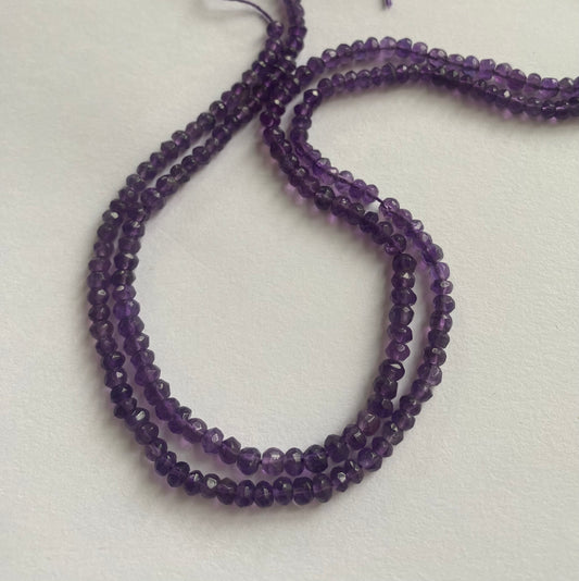 Strand featuring faceted rondelle amethyst gemstones, ranging from 3.5mm to 4mm, in a stunning purple hue.