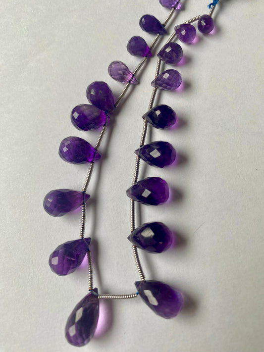 Elegant strand adorned with 5mm to 8mm faceted tear drop amethyst stones, showcasing a rich purple colour.