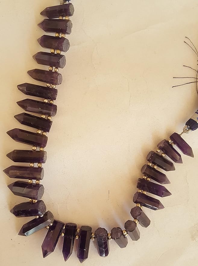 A vibrant purple gemstone bead strand, adorned with Amethyst gemstones.
