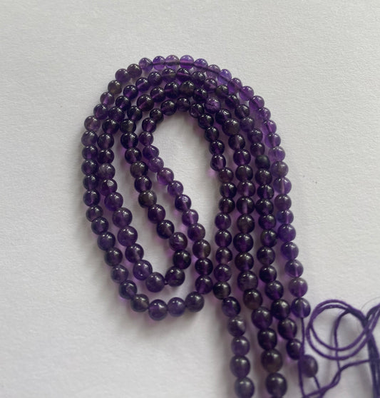 Elegant strand adorned with 4.5mm round amethyst stones, showcasing a rich purple colour.