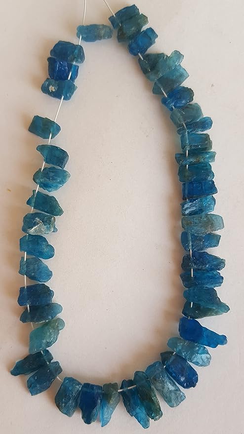 Elegant strand adorned with 4mm to 5mm Apatite Raw Rough Side Drilled Bead showcasing a rich blue colour.