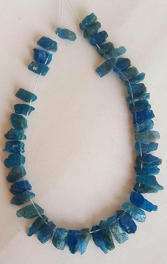 Strand featuring Apatite Raw Rough Side Drilled gemstone beads, ranging from 4mm to 5mm, in a stunning purple hue.