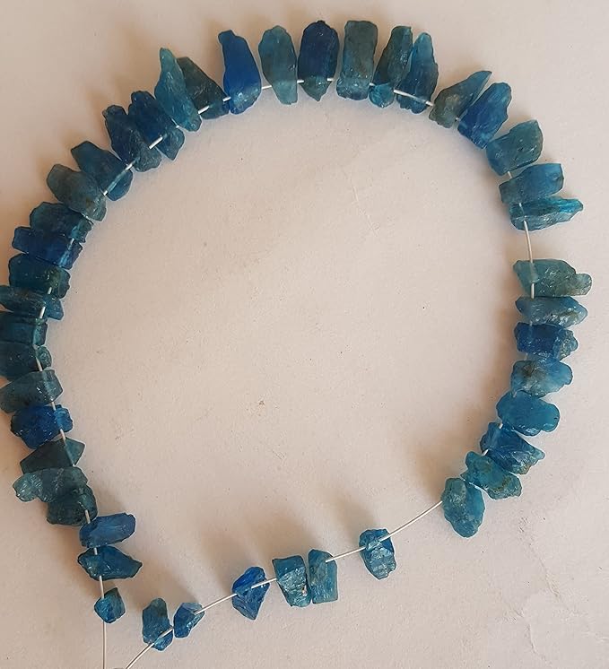 Strand featuring Apatite Raw Rough Side Drilled, ranging from 4mm to 4mm, in a stunning blue hue.
