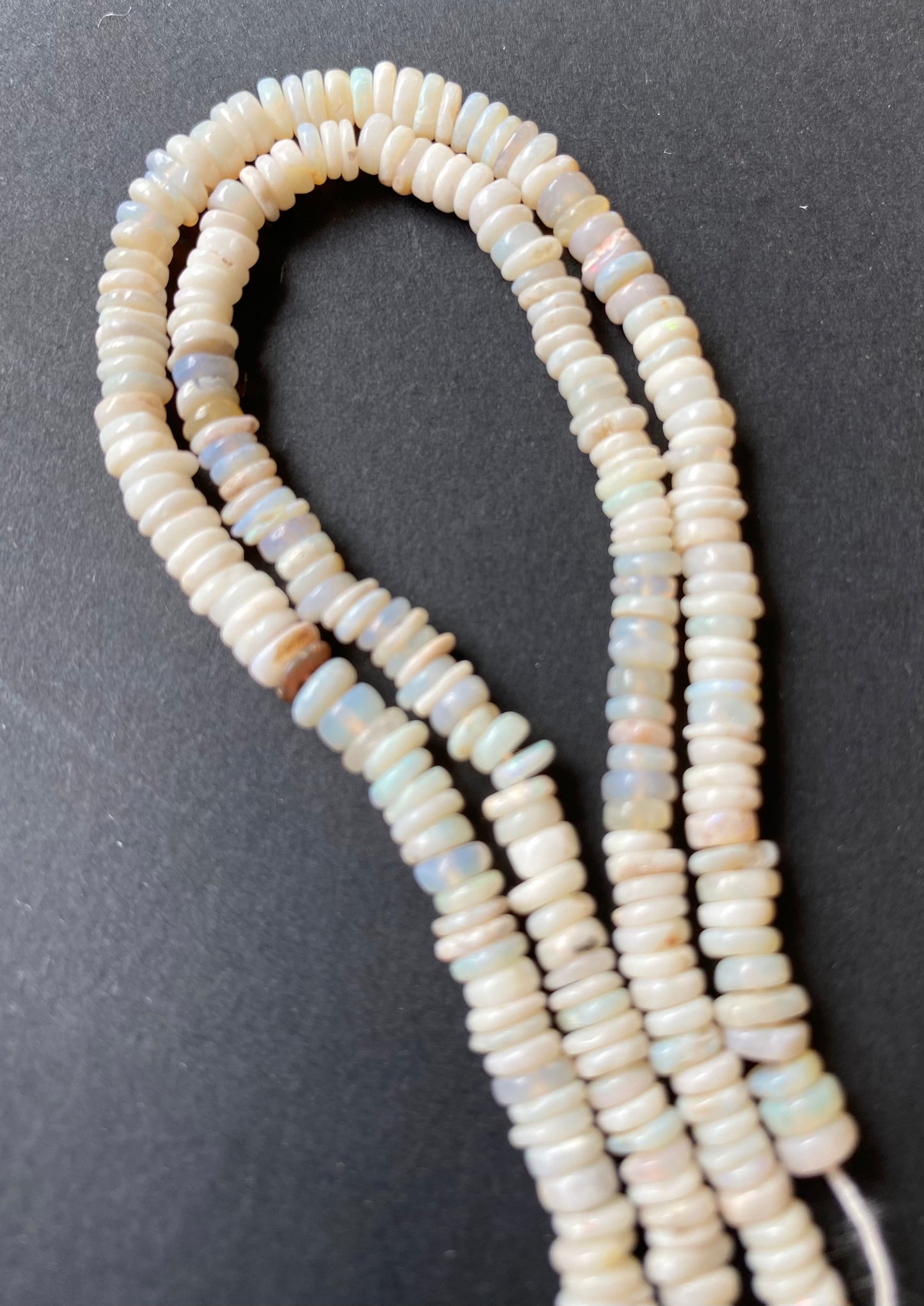 Featuring smooth Australian opal beads, 4-4.5mm in size, showcasing a beautiful white hue.