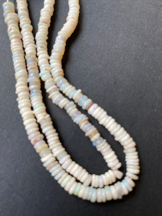 Stunning 4-4.5mm smooth white opal gemstone beads, reflecting the unique charm of Australian opals.