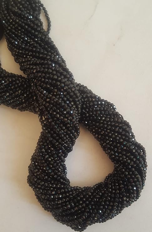 Stylish strands made of 2mm black spinel faceted rondelle beads, highlighting its sophisticated look.