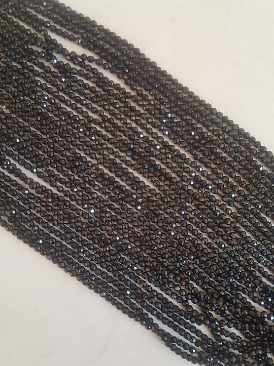 A close-up of a multiple strands featuring black spinel faceted rondelle beads, measuring 2mm in size.