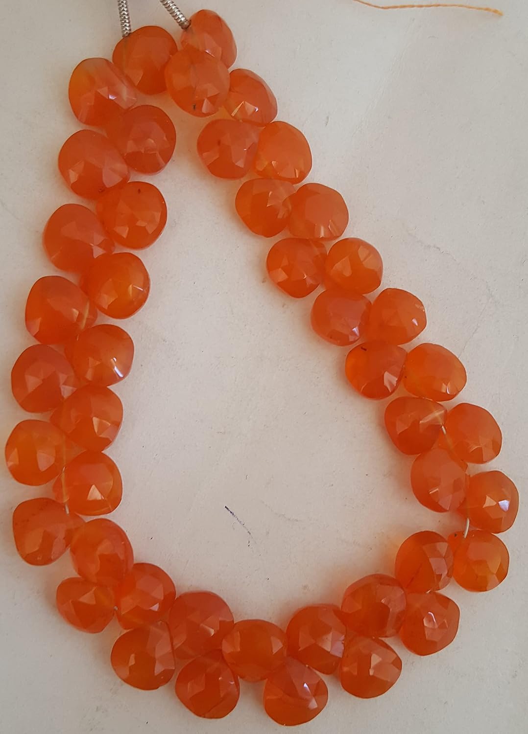 Stunning strand with 8mm Carnelian Briolette beads, ideal for a stylish accessory.