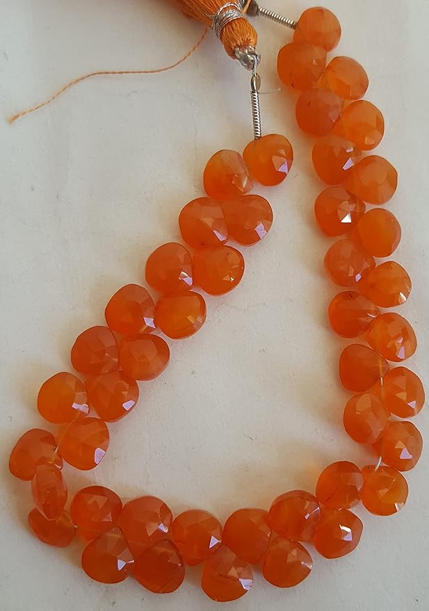 Elegant strand of natural carnelian gemstone, beads sized 8mm, highlighting their natural beauty and vibrant colour.
