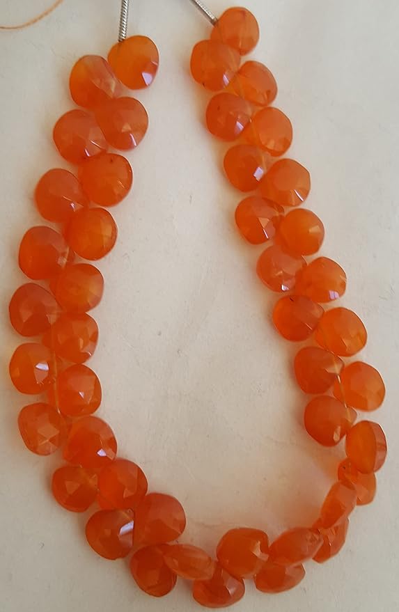 Strand featuring 8mm briolette beads in a vibrant colour, showcasing the beauty of carnelian.