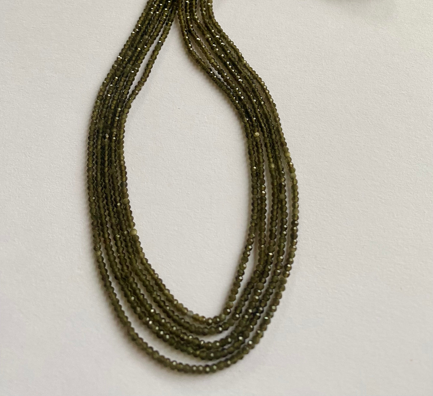 Stunning 2mm smooth green cat's eye gemstone beads, reflecting the unique charm of gemstone.
