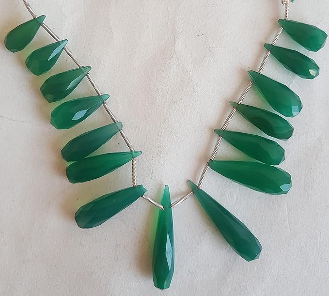Elegant strand adorned with faceted Chalcedony stones, showcasing a rich green colour.