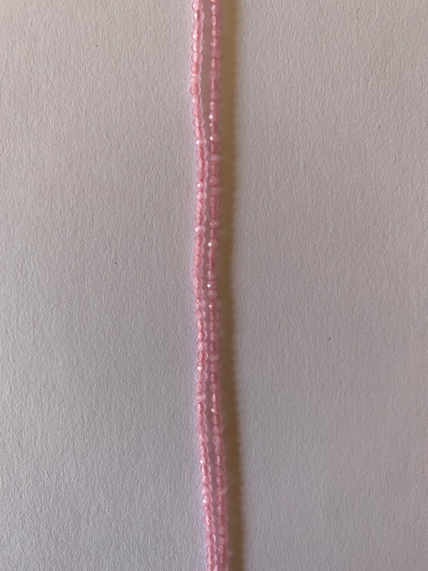 A long strands of 2-2.2mm chalcedony beads, showcasing a pink faceted rondelles, ideal for crafting and design.