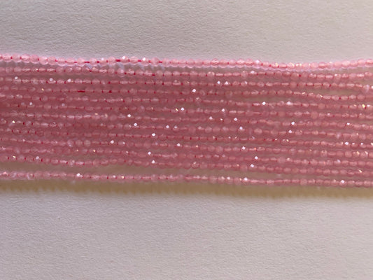 Long strands of pink chalcedony faceted rondelle beads, showcasing their natural beauty and unique colours.