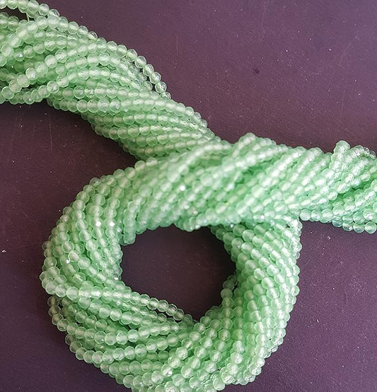 Strands featuring 2.5mm faceted rondelle beads in a vibrant green colour, showcasing the beauty of chalcedony.