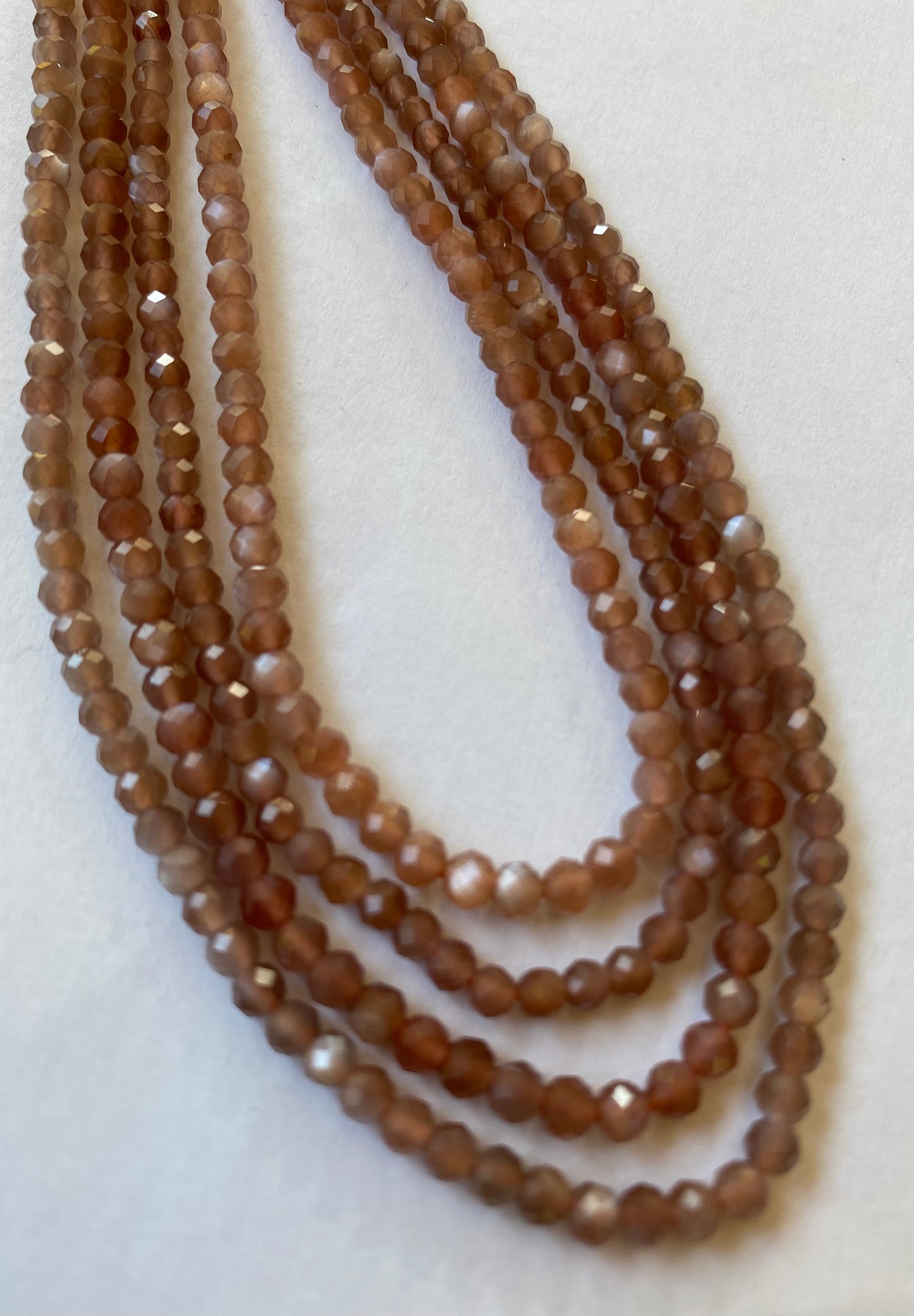 Strands featuring faceted rondelle moonstone gemstones, 3.5mm beads, in a stunning brown hue.