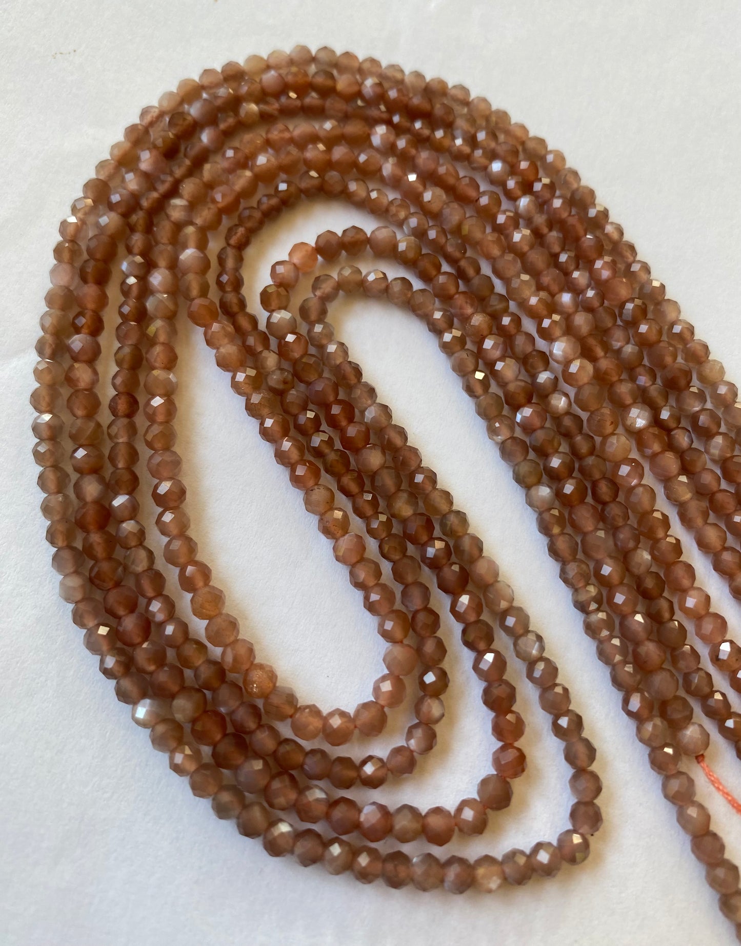 Elegant strands adorned with 3.5mm faceted rondelle moonstone stones, showcasing a rich brown colour.