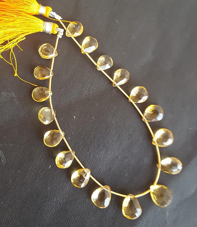 Stunning strand with yellow citrine faceted pear beads, ideal for a stylish accessory.