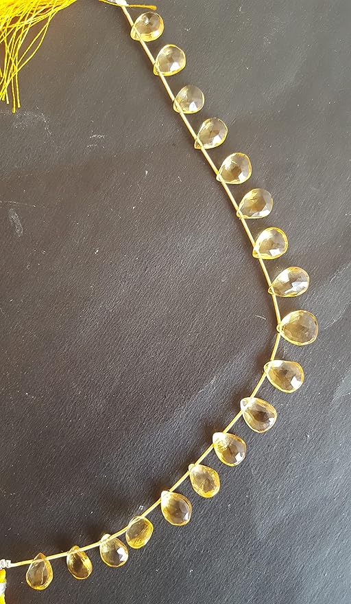 Elegant strand adorned with yellow Citrine faceted pear beads, perfect for adding a pop of colour.