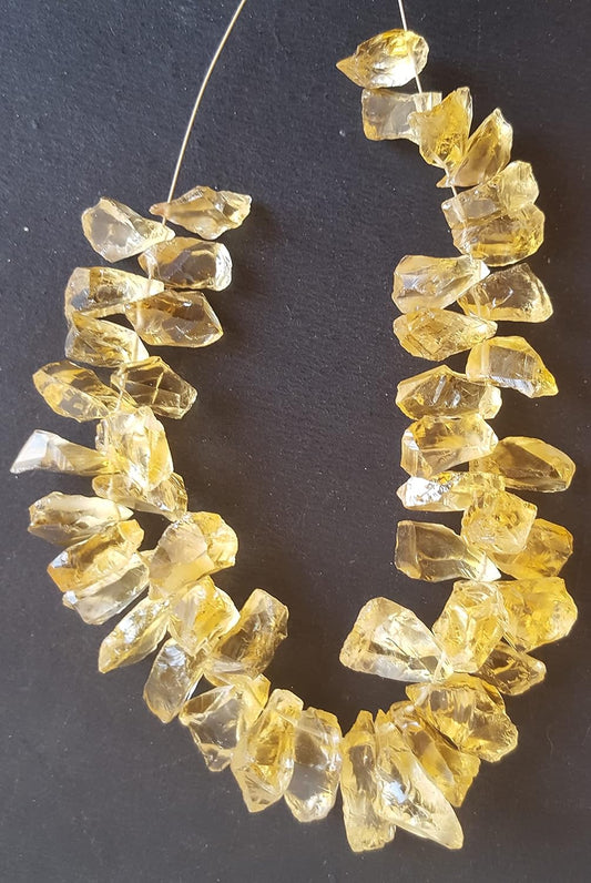 Elegant strand of rough yellow natural citrine gemstone,highlighting their natural beauty and vibrant colour.