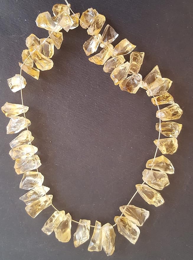 Elegant strand of rough yellow natural citrine gemstone, beads sized 7mm to 9mm, highlighting their natural beauty and vibrant colour.