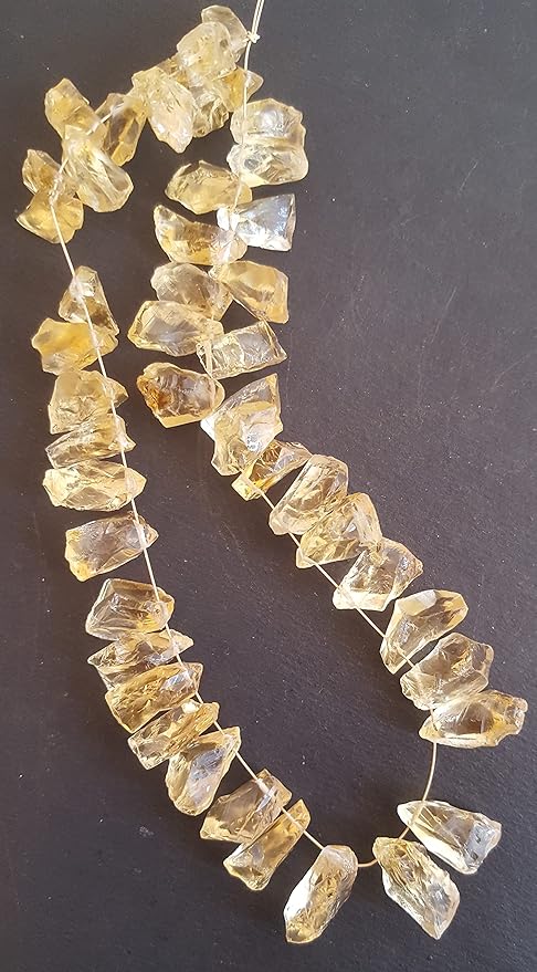 Strands featuring yellow citrine gemstones, each bead measuring 7mm to 9mm, showcasing a rough, natural texture.