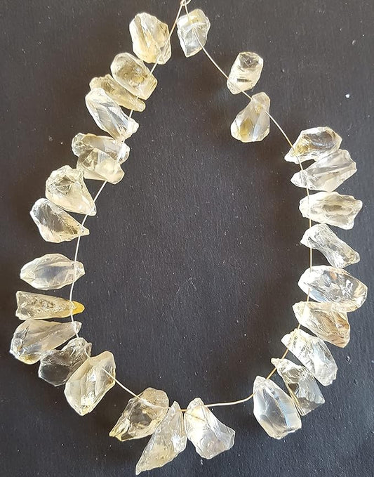Strands featuring yellow citrine gemstones, each bead measuring 9mm to 10mm, showcasing a rough, natural texture.