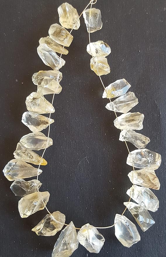 Elegant strand of rough yellow natural citrine gemstone, beads sized 9mm to 10mm, highlighting their natural beauty and vibrant colour.