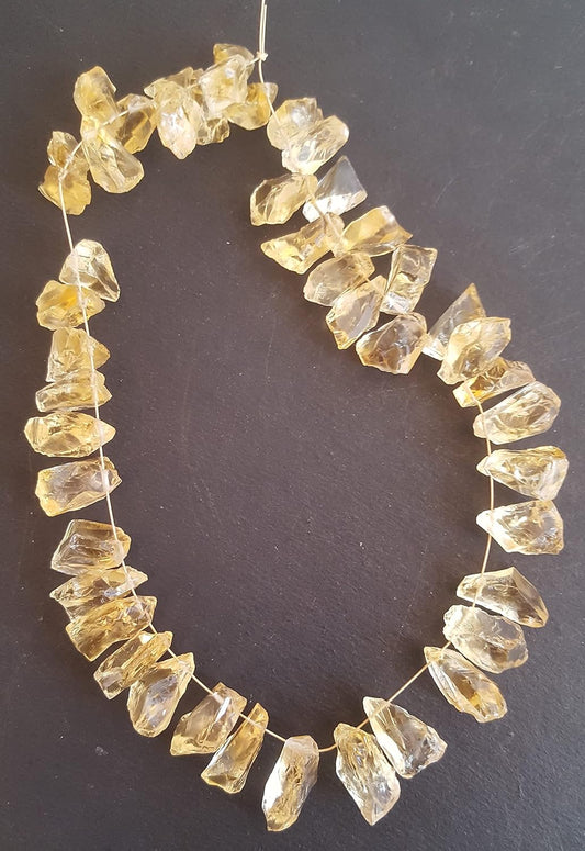 Strands featuring yellow citrine gemstones, each bead measuring 9mm to 9mm, showcasing a rough, natural texture.