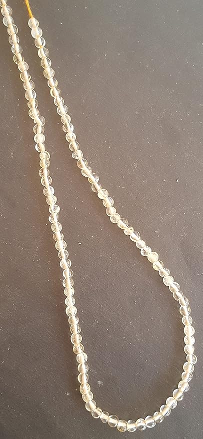 A grouping of 3.5mm smooth citrine beads, highlighting their beautiful hue.