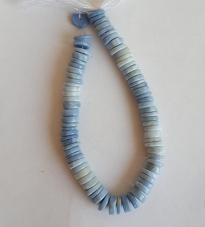 A strand displaying a variety of colourful stones, crafted from smooth wheel-shaped Denim Opal gemstone beads.