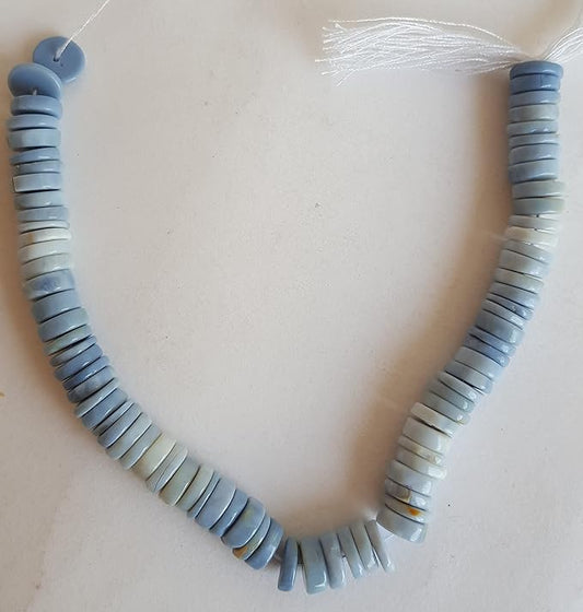 A colourful strand made of smooth wheel-shaped Denim Opal gemstone beads in multiple hues.