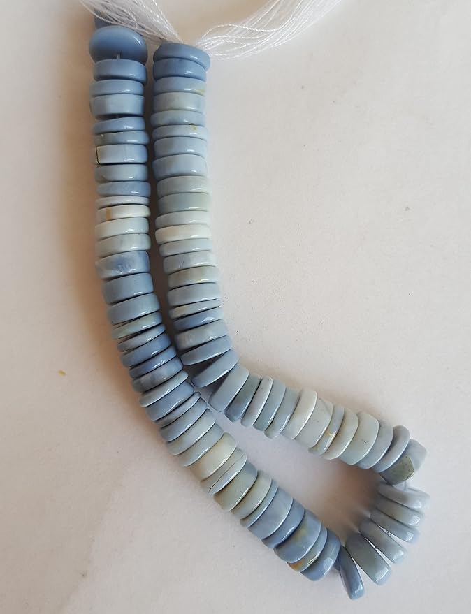 A vibrant strand featuring an array of colourful Denim Opal gemstone beads in smooth wheel shapes.