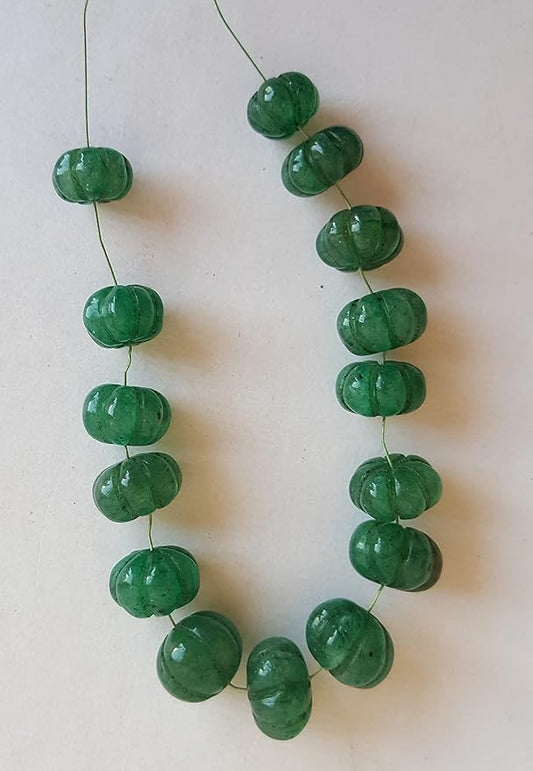 Strand featuring carved rondelle emerald gemstones, ranging from 9mm to 10mm, in a stunning green hue.