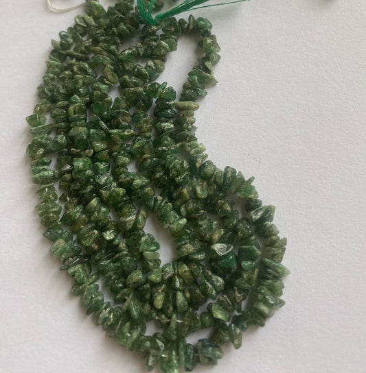 Strand featuring Emerald chip gemstones, ranging from 5mm to 7mm, in a stunning green hue.