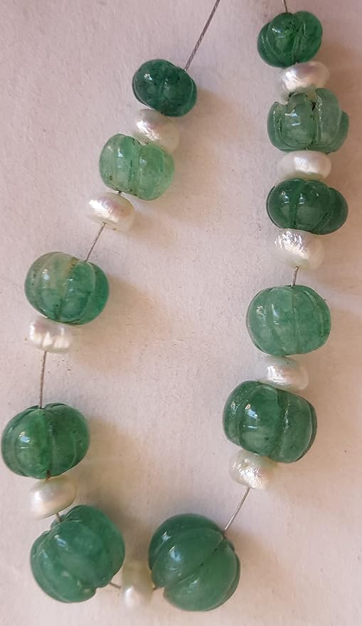 A vibrant green emerald bead with freshwater pearls, designed in a carved rondelle style, sizes ranging from 7mm to 10mm.