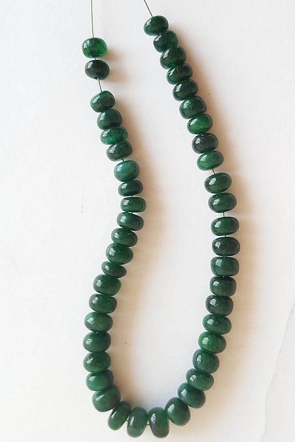A strand of smooth emerald rondelle gemstone beads, measuring 5mm to 6mm, showcasing their vibrant colour and shine.
